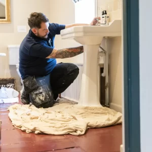 DMA Plumber checking Bathroom Sink