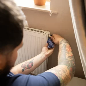 Repairing a radiator at Deans Court
