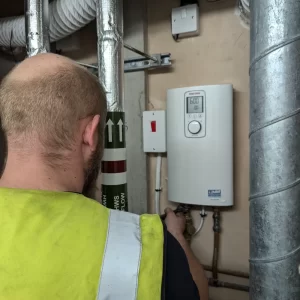 DMA fixing water heaters at a student accommodation