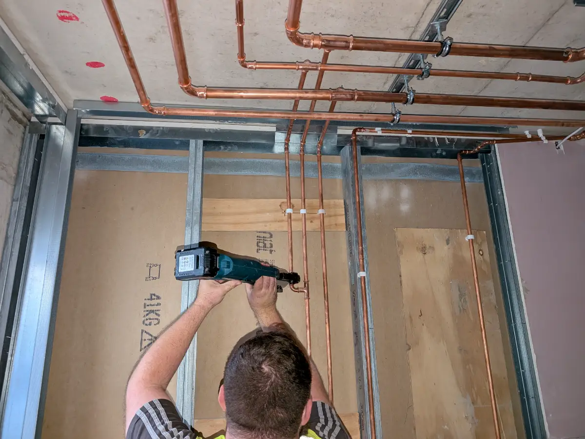 Wimbledon Development DMA Working on Pipework